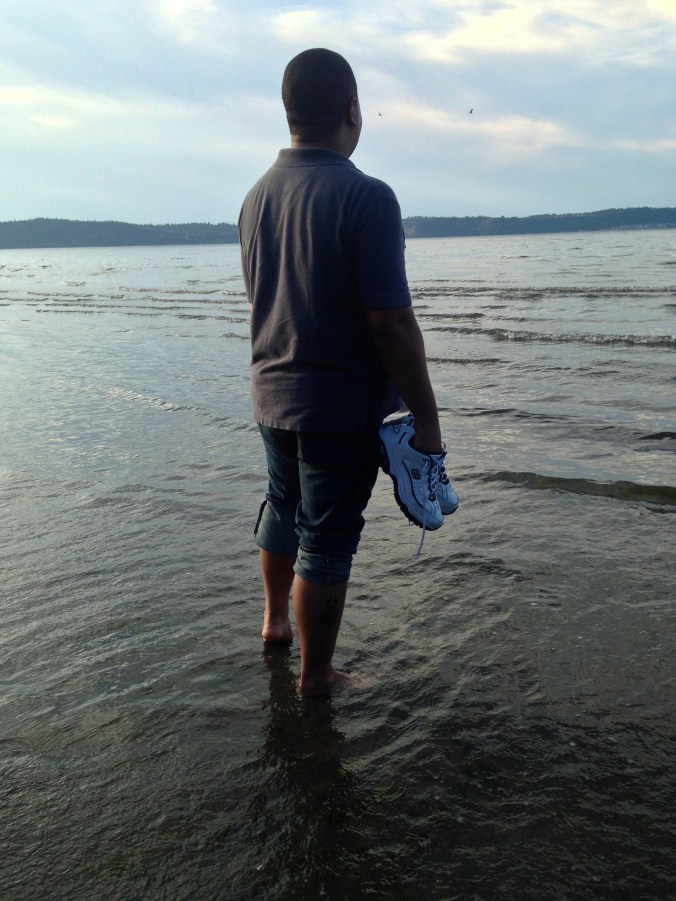 Tim, sinking his toes into the sands of the Sound.